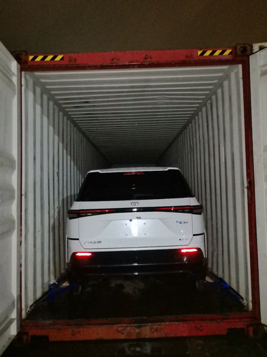 Toyota bZ3X inside a shipping container in the YIHUI CARS Guyana export case