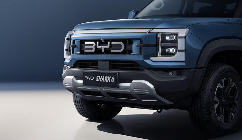 BYD Shark 6 plug-in hybrid AWD pickup front detail official product photo